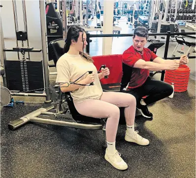  ?? ?? Trainer Jesse Horvath works with a client. For some people, working with a personal trainer brings great results, while others love exercising in a class setting with others.