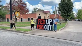  ?? DIMA AMRO ?? About 10 protesters gathered outside of the MPD Ridgeway station where U.S. Attorney General William Barr would later talk about Operation Legend, an initiative that brings in federal officers to combat violent crime in Memphis and other cities.