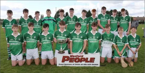  ??  ?? The victorious Cloughbawn squad with the spoils of victory.