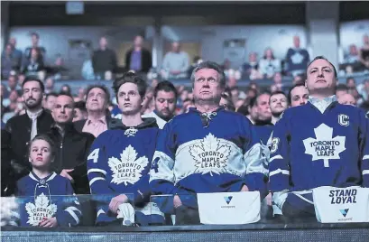  ?? STEVE RUSSELL/TORONTO STAR ?? Fans observe a moment of silence prior to Game 6 of the Leafs-Bruins playoff game at the ACC on Monday night.