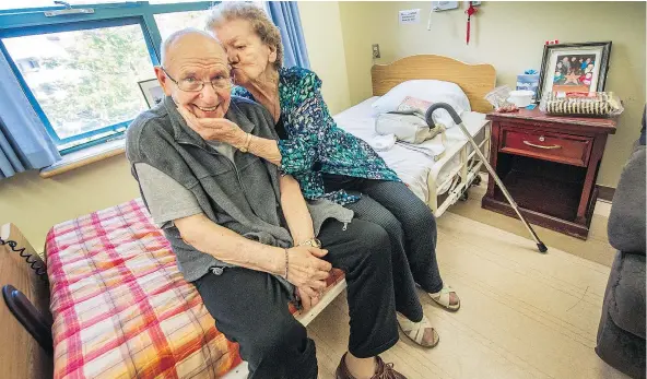  ?? ARLEN REDEKOP/PNG ?? Raffaella Lucchesi visits her husband Domenic at Little Mountain Place in Vancouver. Raffaella still lives at home because she is not considered in urgent need of care. And after 65 years of marriage, the couple is finding it difficult to live apart.