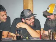  ?? Provided by Wynkoop Brewing ?? From left, PJ Hoberman, Michael Roberts and Tony Drewry judge the Beer Drinker of the Year contest at the Wynkoop in 2016.