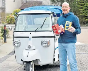  ??  ?? EYE-CATCHING: Robert Carmichael with his striking Tuk Tuk rickshaw