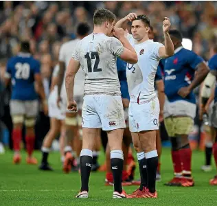  ?? GETTY IMAGES ?? England players Owen Farrell, left, and Ben Youngs digest the loss to France in Paris.