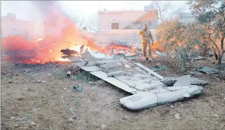  ?? Omar Haj Kadour AFP/Getty Images ?? THE SUKHOI-25 JET went down over the northwest province of Idlib, a rebel stronghold. Two groups claimed they had shot it down.