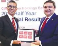  ?? ASYRAF RASID/ THESUN ?? Zafrul (left) and group CFO Shahnaz Jammal during CIMB’s half-year financial results press conference.