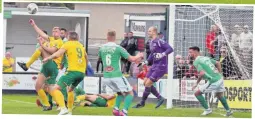  ??  ?? ● Caernarfon Town’s Jamie Crowther goes close with this overhead attempt against Barry.