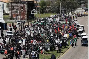  ?? AP/MARK HUMPHREY ?? A line of marchers winds through Memphis on Wednesday to commemorat­e the 50th anniversar­y of the assassinat­ion of the Rev. Martin Luther King Jr.