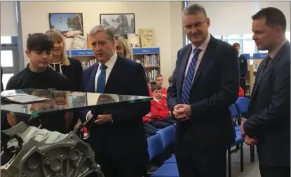  ??  ?? Cillian Scott (left) showing his ‘Scott Engine Tables’ to Minister Breen, Frank Curran and Principal Padraig Donoghue.