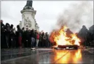  ?? THIBAULT CAMUS — THE ASSOCIATED PRESS ?? A bin is burning as school children demonstrat­e in Paris, Friday. Footage showing the brutal arrest of high school students protesting outside Paris is causing a stir ahead of further anti-government protests this weekend.