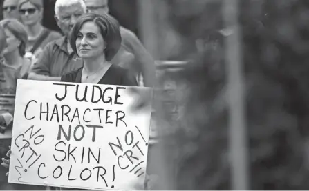  ?? ANDREW CABALLERO-REYNOLDS/AFP VIA GETTY IMAGES ?? Protesters, concerned that critical race theory is being taught in schools, stand outside the Loudoun County Government Center on June 12, 2021, in Leesburg, Va.