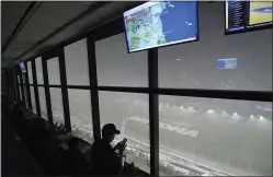  ?? PHELAN M. EBENHACK — THE ASSOCIATED PRESS ?? A downpour, as viewed from the press box, forced the postponeme­nt of the Daytona 500on Sunday. The race will be finished today instead.