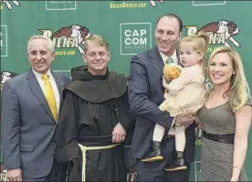  ??  ?? From left, athletic director John D’argenio, Brother F. Edward Coughlin, Carmen Maciariell­o, daughter Reese, 2, and wife Laura gather after Maciariell­o’s introducti­on as Siena’s new men’s basketball head coach.