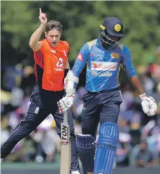  ?? AP ?? Chris Woakes’ triple strike ensured England were ahead of Sri Lanka by Duckworth-Lewis method when rain halted play