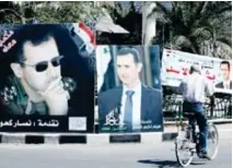  ??  ?? Des portraits géants du président Bachar Al Assad affichés à Damas avant la présidenti­elle de demain