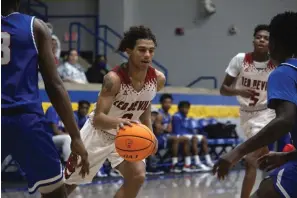  ?? The Sentinel-Record/Krishnan Collins ?? ■ Mountain Pine’s Keelan Dobbins drives into the paint against Strong-Huttig at Lakeside Athletic Complex Wednesday.