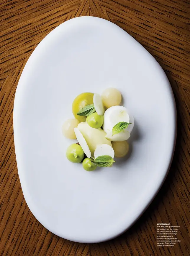  ??  ?? A FRESH FACE
With dairy and gluten mostly eliminated from the menu, the pastry team at Amber has risen to the challenge by creating desserts incorporat­ing ingredient­s such as avocado, lime. Sicilian pistachio, Granny Smith apples and Thai basil