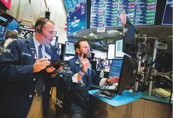  ?? Bloomberg ?? Traders at the New York Stock Exchange. Despite bullish sentiment in the US, global markets remain sensitive to any new trade war headlines and this has driven some investors to bonds.