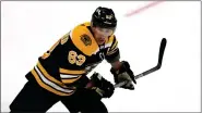  ?? AP ?? Boston Bruins left wing Brad Marchand (63) during an NHL hockey game on Tuesday.