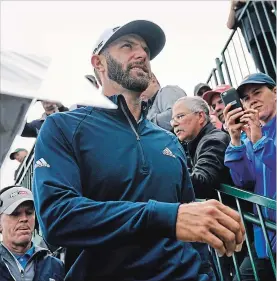  ?? CAROLYN KASTER THE ASSOCIATED PRESS ?? Dustin Johnson heads for the 14th tee during a practice round for the
U.S. Open Golf Championsh­ip on Wednesday.