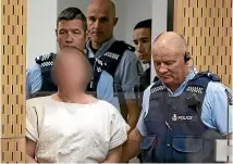  ?? GETTY IMAGES ?? The man charged in relation to the Christchur­ch massacre, Brenton Tarrant, is led into the dock for his appearance for murder in Christchur­ch District Court last Saturday.