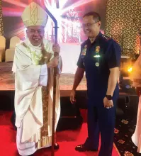  ??  ?? CBCP President and Davao Archbishop Romulo Valles is happy to ask PNP Chief Archie Gamboa to be a “gentle light of a candle amidst the darkness”