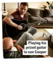  ??  ?? Playing his prized guitar to son Cooper