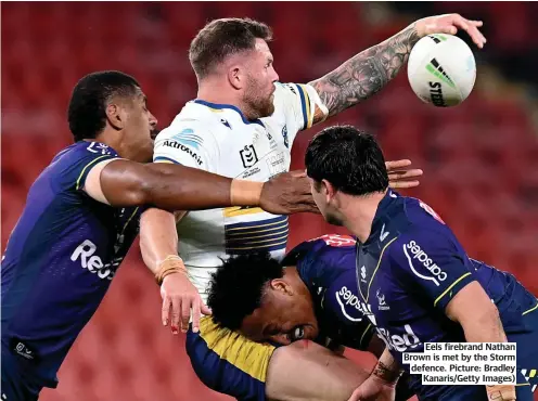  ??  ?? Eels firebrand Nathan Brown is met by the Storm defence. Picture: Bradley Kanaris/Getty Images)