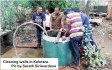 ??  ?? Cleaning wells in Kalutara. Pic by Sarath Siriwarden­e