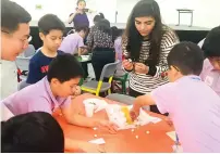  ?? Supplied photo ?? Chinese students take part in a project with Dubai students during their visit to Al Salam Private School. —