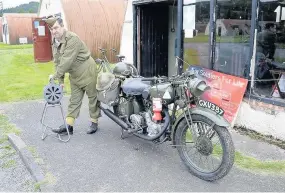  ??  ?? Vroom One of the vintage military motorbikes on display