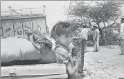  ?? SANJAY SHARMA/HT PHOTO ?? Demolition of a settlement in New Delhi on 10 April 1993