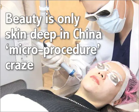  ?? — AFP photos ?? Zhang receiving laser facial treatment at a beauty clinic in Shanghai.