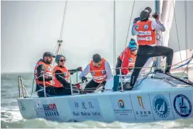  ??  ?? Hyderabad’s Ananya Chouhan (second from left) and her team compete in the J80 Asian Championsh­ip held in Qingdao Olympic Sailing Centre in Qingdao, China.