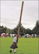  ?? 17_t31taynuil­t02 ?? Nick Charlton makes an attempt at the caber.