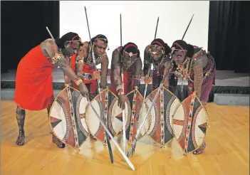  ?? 01_B38maasai0­2 ?? Spears and shields at the ready, the Maasai demonstrat­e their hunting technique.