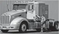  ?? Staff file photo ?? A career in trucking offers a road to the middle class without a four-year college degree. Truck drivers in Texas earn an average salary of $44,260.