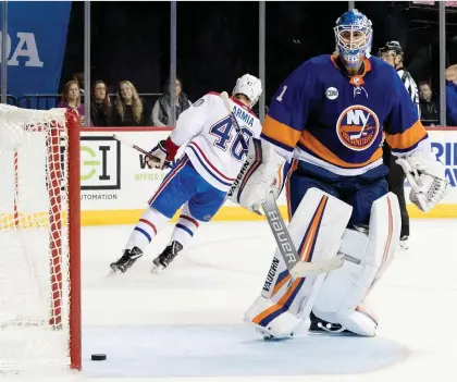  ?? MARY ALTAFFER ?? New York Islanders goalie Thomas Greiss gives up Joel Armia’s game-winning goal in the shootout Monday as the Canadiens won 4-3.