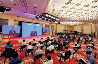  ?? WANG JING / CHINA DAILY ?? Finance Minister Liu Kun answers reporters’ queries online after the opening of the NPC session on Friday in Beijing.