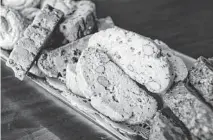  ??  ?? A tray of almond-studded biscotti in the kitchen at La Dolce Vita. Paola Tulliani built her biscotti business from a small kitchen venture into a large operation and has now sold it to the larger Nonni's Foods.