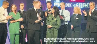  ??  ?? HONOURED Rescuers receiving awards, with Tony Blair, far right, who praised their extraordin­ary work