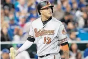  ?? TOM SZCZERBOWS­KI/GETTY IMAGES ?? Manny Machado reacts after striking out in the sixth inning. Monday’s loss put the Orioles 31⁄ games behind the Twins for the second American League wild-card spot.