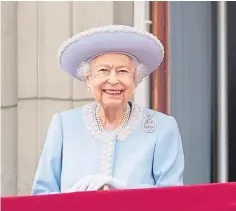  ?? ?? The Queen smiles as she watches the Royal Procession.