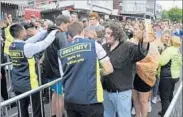  ?? RUI VIEIRA/AP ?? Fans are searched as they arrive for a concert at Old Trafford cricket ground in Manchester, England, on Saturday.