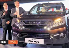  ?? — G.N. JHA ?? Isuzu Motors India chairman Hiroshi Nakagawa (right) along with managing director Naohira Yamaguchi during the launch of MU-X in New Delhi on Thursday.