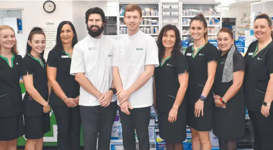  ?? ?? Sophie, Amaya, Sandra, Chris Holland, Craig Menegon, Grace, Rachel, Melina and Melissa at the rebranded Terrywhite Chemmart Ingham, formerly Sadleirs Pharmacy. Picture: Cameron Bates