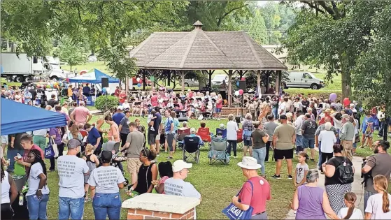  ?? Jeremy stewart ?? Crowds filled Seaborn Jones Park in Rockmart on Saturday, Aug. 20, 2022, to celebrate the city’s sesquicent­ennial. The day kicked off with a parade followed by an event in the park featuring performanc­es from the Rockmart Community Chorus and Rockmart High School Chorus as well as free hot dogs, hamburgers, drinks and activities for kids. Rockmart was officially incorporat­ed in August 1872.