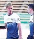  ?? AFP ?? Cambodia coach Keisuke Honda (left) takes training at Olympic Stadium in September.