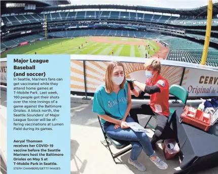  ?? STEPH CHAMBERS/GETTY IMAGES ?? Aeryal Thomsen receives her COVID-19 vaccine before the Seattle Mariners host the Baltimore Orioles on May 5 at T-Mobile Park in Seattle.