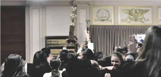  ?? ELIZABETH MAYORAL CORPUS PHOTO ?? Students of the Vincent Memorial Catholic High School Mock Trial team celebrate while holding the trophy after winning the Imperial County Mock Trial Competitio­n Championsh­ip, Wednesday, February 8, at the Imperial County Superior Court in El Centro.